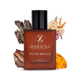 A bottle of Zodiaura Oudh Rouge unisex perfume EDP spray with floral and oud fragrance accord, presented with a background of wood and flowers, indicating a luxury fragrance product.
